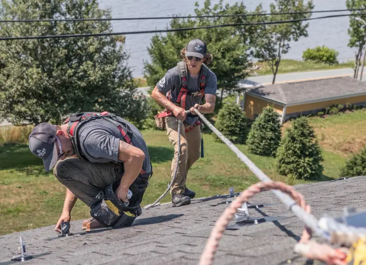 Two Solar Ascent installers on roof